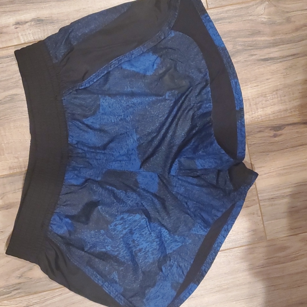 Blue and black nike athletic shorts